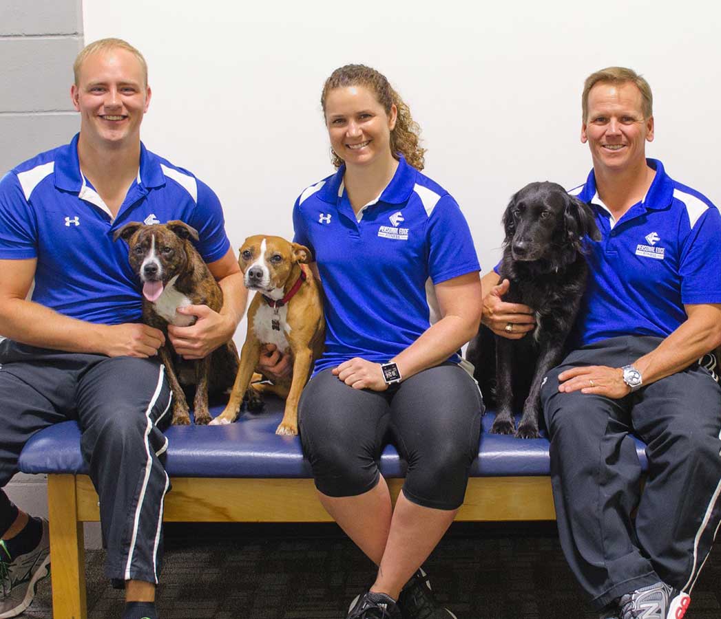 Personal Edge Fitness trainers and their dogs