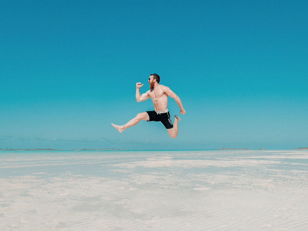 Fit man Running at the Beach